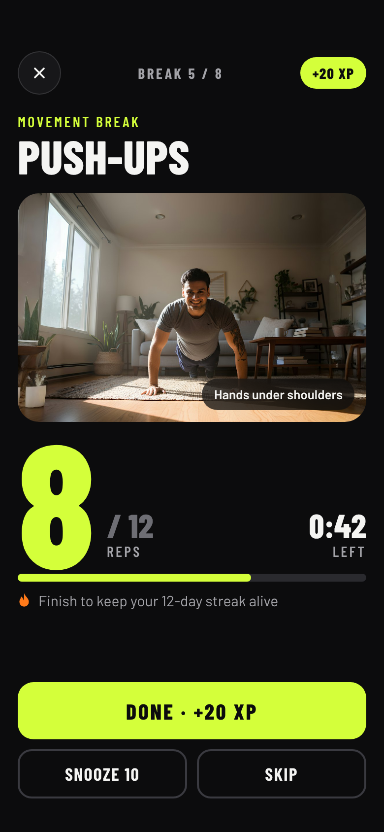 The break screen: push-ups, 8 of 12 done, with a photo of the move